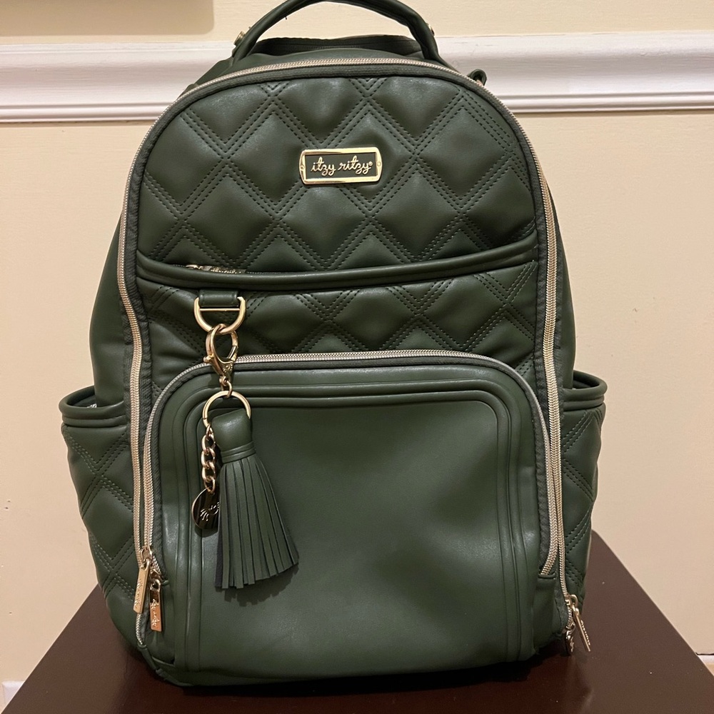 Itzy Ritzy Olive Miracle Boss Plus Diaper Bag Backpack with Changing Pad.